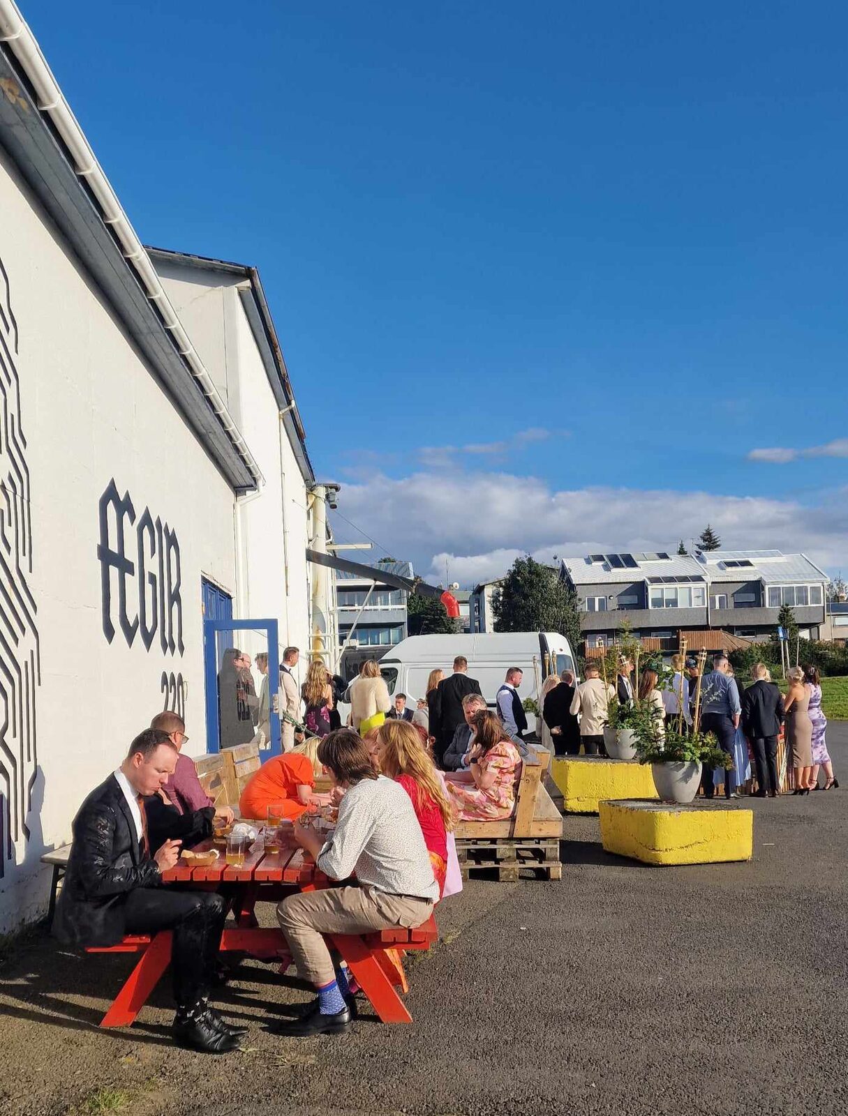 Guests outside ÆGIR 220 on a sunny day